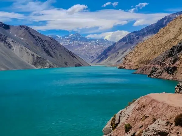Turquoise Embalse El Yeso reservoir in the Andes