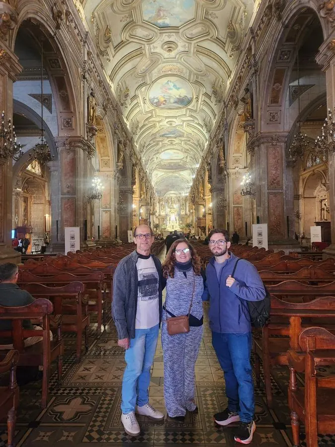 Travelers inside the Metropolitan Cathedral of Santiago