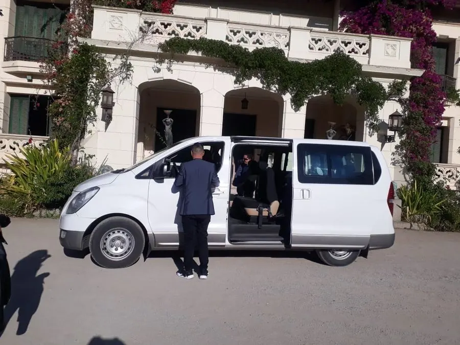 White Hyundai van waiting for guests in front of a winery manor