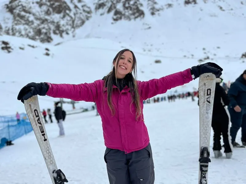 Traveler with skis at a ski resort near Santiago, Chile