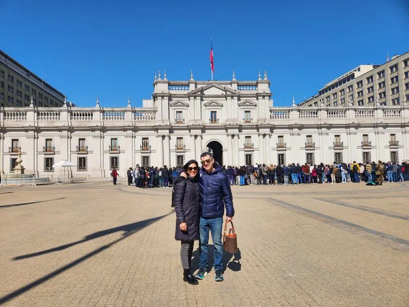 Couple in front of La Moneda Palace in Santiago, Chile