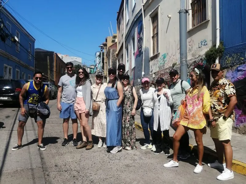Group of travelers on a colorful street in Valparaíso, Chile
