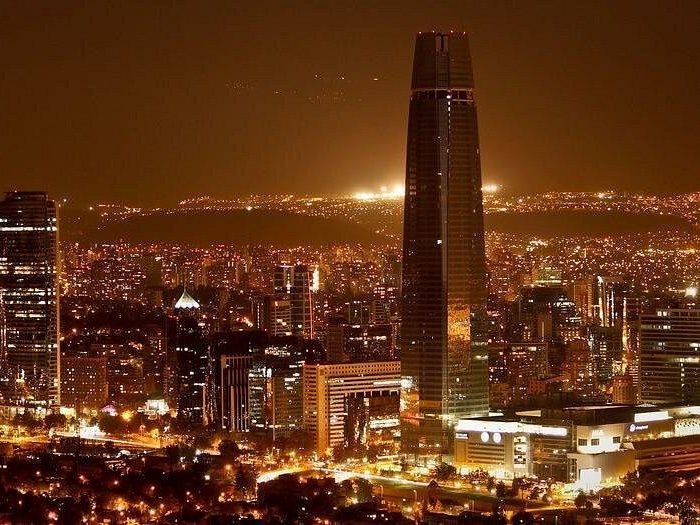 Santiago skyline with the Gran Torre lit up at night, Chile