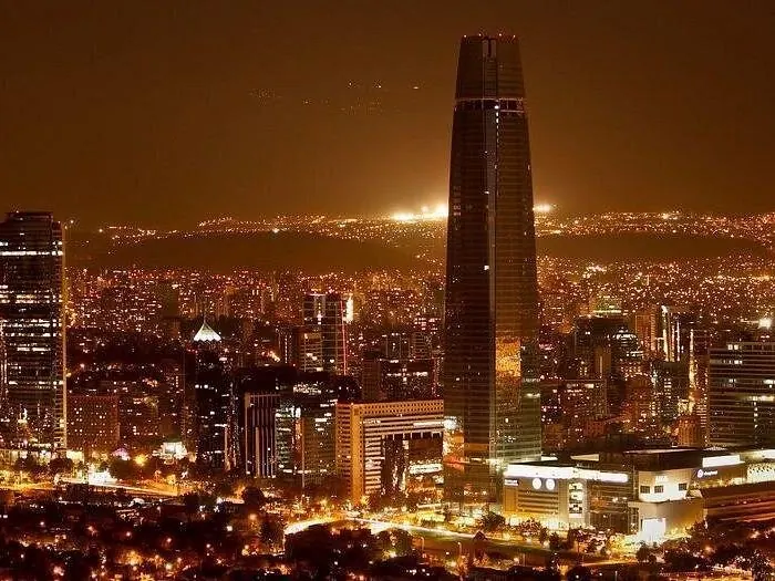 Santiago skyline with the Gran Torre lit up at night, Chile