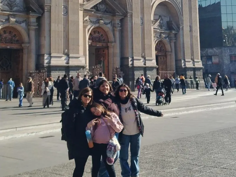 Travelers in front of the Metropolitan Cathedral on Plaza de Armas, Santiago