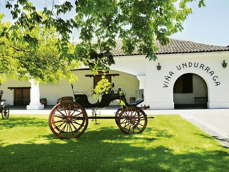 Entrance of Viña Undurraga winery with a vintage carriage, Chile