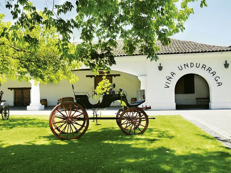 Entrance of Viña Undurraga winery with a vintage carriage, Chile