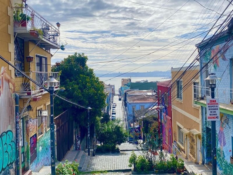 Colorful street in Valparaíso sloping down to the bay, Chile